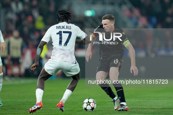 Ngal'ayel Mukau of LOSC Lille and Lewis Ferguson of Bologna FC compete for the ball during the UEFA Champions League 2024/25 League Phase MD...