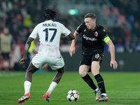 Ngal'ayel Mukau of LOSC Lille and Lewis Ferguson of Bologna FC compete for the ball during the UEFA Champions League 2024/25 League Phase MD...