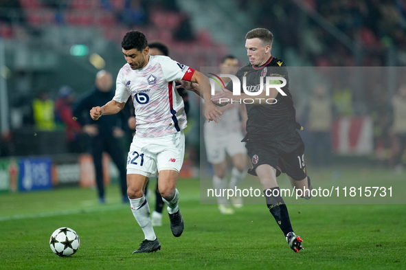 Benjamin Andre' of LOSC Lille and Lewis Ferguson of Bologna FC compete for the ball during the UEFA Champions League 2024/25 League Phase MD...