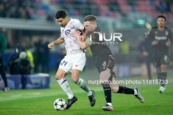 Benjamin Andre' of LOSC Lille and Lewis Ferguson of Bologna FC compete for the ball during the UEFA Champions League 2024/25 League Phase MD...