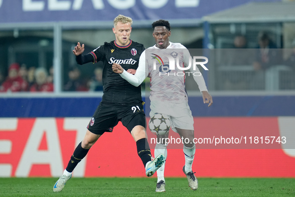 Jonathan David of LOSC Lille and Jens Odgaard of Bologna FC compete for the ball during the UEFA Champions League 2024/25 League Phase MD5 m...