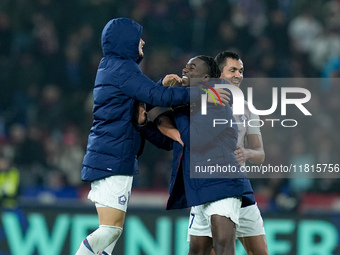 Ngal'ayel Mukau of LOSC Lille celebrates. the victory with Aissa Mandi of LOSC Lille during the UEFA Champions League 2024/25 League Phase M...