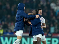 Ngal'ayel Mukau of LOSC Lille celebrates. the victory with Aissa Mandi of LOSC Lille during the UEFA Champions League 2024/25 League Phase M...