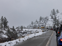 A winter storm brings chain control and delays on Interstate 80 East near Cisco Grove, Calif., on November 27, 2024. (