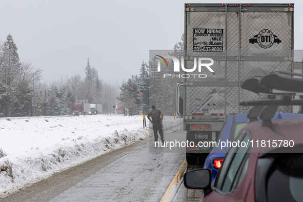 A winter storm brings chain control and delays on Interstate 80 East near Cisco Grove, Calif., on November 27, 2024. 