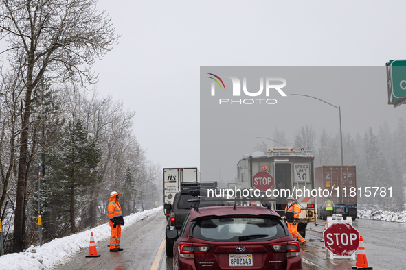 A winter storm brings chain control and delays on Interstate 80 East near Cisco Grove, Calif., on November 27, 2024. 