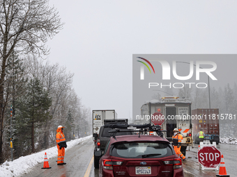 A winter storm brings chain control and delays on Interstate 80 East near Cisco Grove, Calif., on November 27, 2024. (