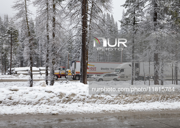 A winter storm brings chain control and delays on Interstate 80 East near Cisco Grove, Calif., on November 27, 2024. 