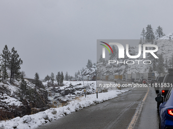 A winter storm brings chain control and delays on Interstate 80 East near Cisco Grove, California, on November 26, 2024. (