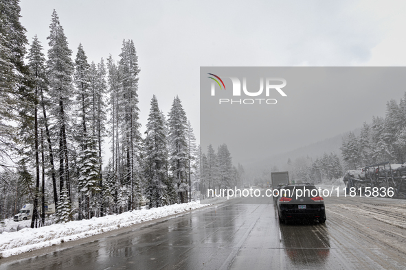 A winter storm brings chain control and delays on Interstate 80 East near Cisco Grove, California, on November 26, 2024. 