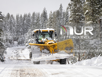 A winter storm brings chain control and delays on Interstate 80 East near Cisco Grove, California, on November 26, 2024. (