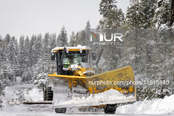 A winter storm brings chain control and delays on Interstate 80 East near Cisco Grove, California, on November 26, 2024. 