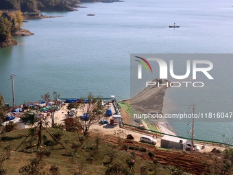 Workers work at the Longtanxi water intake site of the South-to-North Water Diversion project in the Three Gorges Reservoir area of Yichang,...