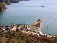 Workers work at the Longtanxi water intake site of the South-to-North Water Diversion project in the Three Gorges Reservoir area of Yichang,...