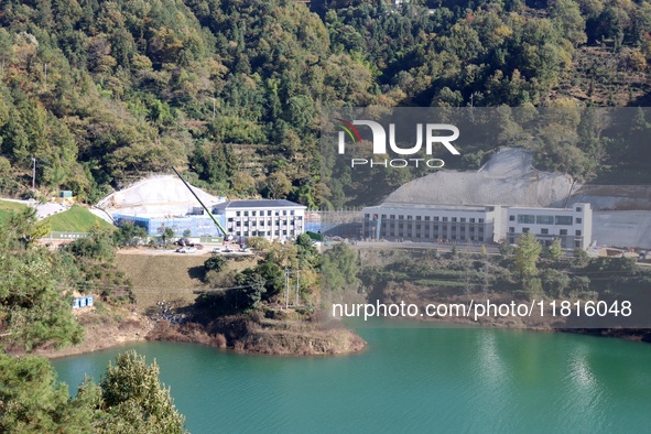 Workers work at the Longtanxi water intake site of the South-to-North Water Diversion project in the Three Gorges Reservoir area of Yichang,...