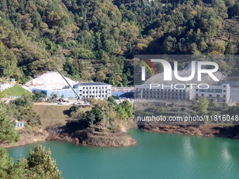 Workers work at the Longtanxi water intake site of the South-to-North Water Diversion project in the Three Gorges Reservoir area of Yichang,...