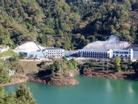 Workers work at the Longtanxi water intake site of the South-to-North Water Diversion project in the Three Gorges Reservoir area of Yichang,...