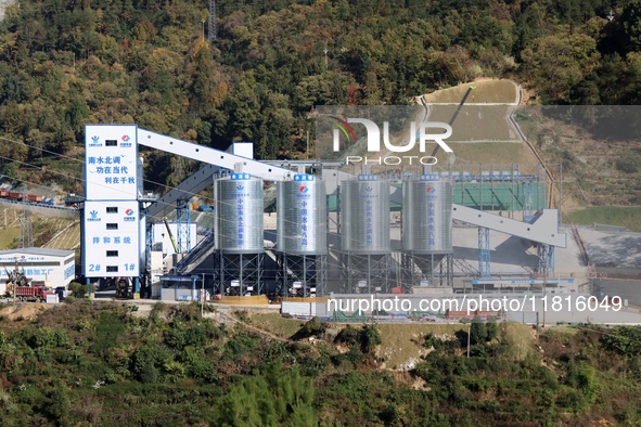 Workers work at the Longtanxi water intake site of the South-to-North Water Diversion project in the Three Gorges Reservoir area of Yichang,...