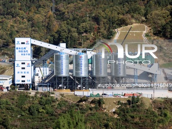 Workers work at the Longtanxi water intake site of the South-to-North Water Diversion project in the Three Gorges Reservoir area of Yichang,...