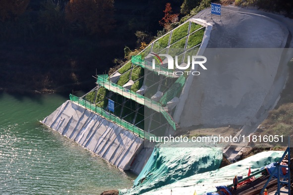 Workers work at the Longtanxi water intake site of the South-to-North Water Diversion project in the Three Gorges Reservoir area of Yichang,...