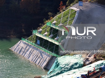 Workers work at the Longtanxi water intake site of the South-to-North Water Diversion project in the Three Gorges Reservoir area of Yichang,...