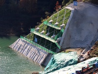 Workers work at the Longtanxi water intake site of the South-to-North Water Diversion project in the Three Gorges Reservoir area of Yichang,...