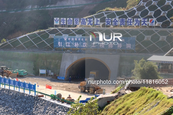 Workers work at the Longtanxi water intake site of the South-to-North Water Diversion project in the Three Gorges Reservoir area of Yichang,...