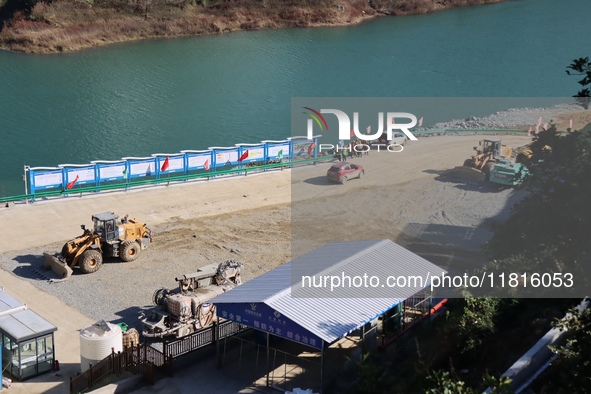 Workers work at the Longtanxi water intake site of the South-to-North Water Diversion project in the Three Gorges Reservoir area of Yichang,...