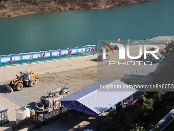 Workers work at the Longtanxi water intake site of the South-to-North Water Diversion project in the Three Gorges Reservoir area of Yichang,...