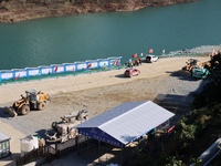 Workers work at the Longtanxi water intake site of the South-to-North Water Diversion project in the Three Gorges Reservoir area of Yichang,...