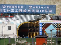 Workers work at the Longtanxi water intake site of the South-to-North Water Diversion project in the Three Gorges Reservoir area of Yichang,...