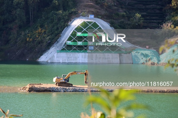 Workers work at the Longtanxi water intake site of the South-to-North Water Diversion project in the Three Gorges Reservoir area of Yichang,...