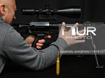 KRAKOW, POLAND - NOVEMBER 27:   
A participant tests the 12.7 ZMT WKW 50 large-caliber sniper rifle, produced by PGZ Zaklady Mechaniczne Tar...