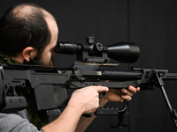 KRAKOW, POLAND - NOVEMBER 27:   
A participant tests the 12.7 ZMT WKW 50 large-caliber sniper rifle, produced by PGZ Zaklady Mechaniczne Tar...