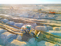 Large machinery levels the land at a high-standard farmland construction site in Weili County, Bayingoleng Mongolian Autonomous Prefecture,...