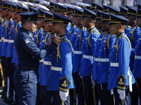 A military officer adjusts the uniform of a member of the royal guard during a welcoming ceremony for Singapore's Prime Minister Lawrence Wo...