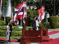 Singapore's Prime Minister Lawrence Wong and Thailand's Prime Minister Paetongtarn Shinawatra review the guard of honor during a welcoming c...