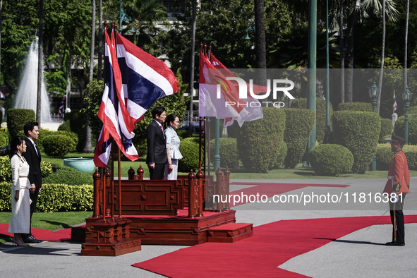 Singapore's Prime Minister Lawrence Wong and Thailand's Prime Minister Paetongtarn Shinawatra review the guard of honor during a welcoming c...