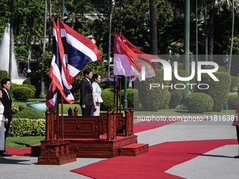 Singapore's Prime Minister Lawrence Wong and Thailand's Prime Minister Paetongtarn Shinawatra review the guard of honor during a welcoming c...