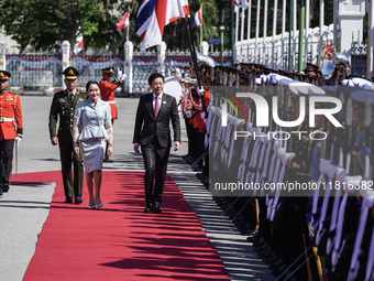 Singapore's Prime Minister Lawrence Wong and Thailand's Prime Minister Paetongtarn Shinawatra review the guard of honor during a welcoming c...