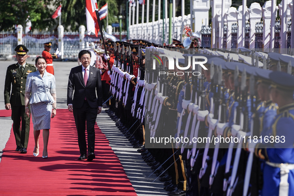 Singapore's Prime Minister Lawrence Wong and Thailand's Prime Minister Paetongtarn Shinawatra review the guard of honor during a welcoming c...