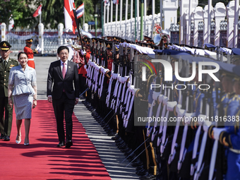 Singapore's Prime Minister Lawrence Wong and Thailand's Prime Minister Paetongtarn Shinawatra review the guard of honor during a welcoming c...