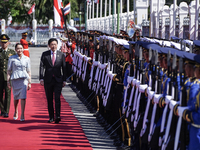 Singapore's Prime Minister Lawrence Wong and Thailand's Prime Minister Paetongtarn Shinawatra review the guard of honor during a welcoming c...