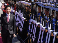 Singapore's Prime Minister Lawrence Wong reviews the guard of honor during a welcoming ceremony at Government House in Bangkok, Thailand, on...