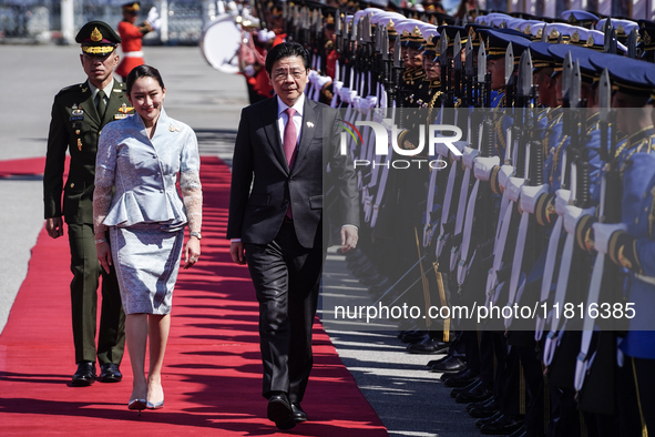 Singapore's Prime Minister Lawrence Wong and Thailand's Prime Minister Paetongtarn Shinawatra review the guard of honor during a welcoming c...