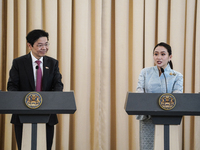 Singapore's Prime Minister Lawrence Wong speaks, and Thailand's Prime Minister Paetongtarn Shinawatra is present during a press conference a...