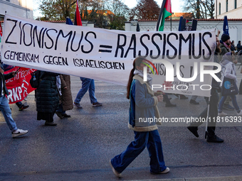 In Munich, Germany, on November 16, 2024, a Pro-Palestinian rally organized by 'Palastina Spricht' takes place, with participants advocating...