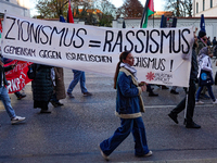 In Munich, Germany, on November 16, 2024, a Pro-Palestinian rally organized by 'Palastina Spricht' takes place, with participants advocating...