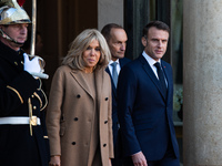 French President Emmanuel Macron and First Lady Brigitte receive Nigeria's President Bola Tinubo, who visits France for two days with the Fi...