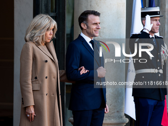 French President Emmanuel Macron and First Lady Brigitte receive Nigeria's President Bola Tinubo, who visits France for two days with the Fi...